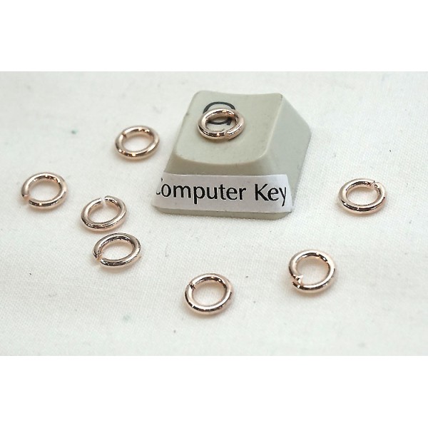 Jump rings, round, 6x0.9mm, rose gold plate, per 100