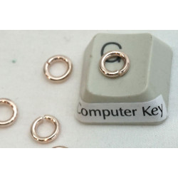 Jump rings, round, 6x0.9mm, rose gold plate, per 100