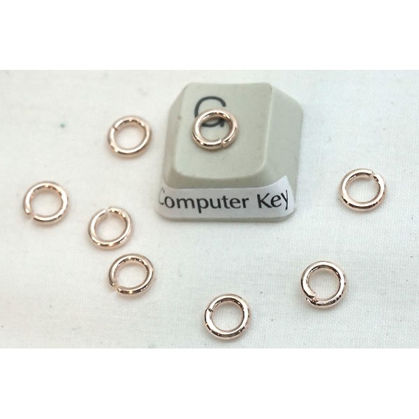 Jump rings, round, 6x0.9mm, rose gold plate, per 100