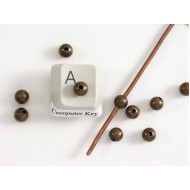 Filler Bead 5mm antique brass plated, seamless, per 50