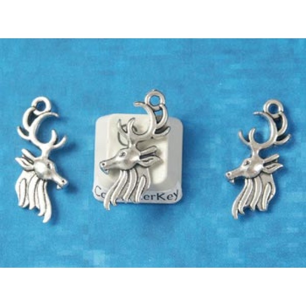 Charm, reindeer Deer head with antlers and winter mane