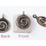 Charm, NZ Koru spiral, antiqued brass